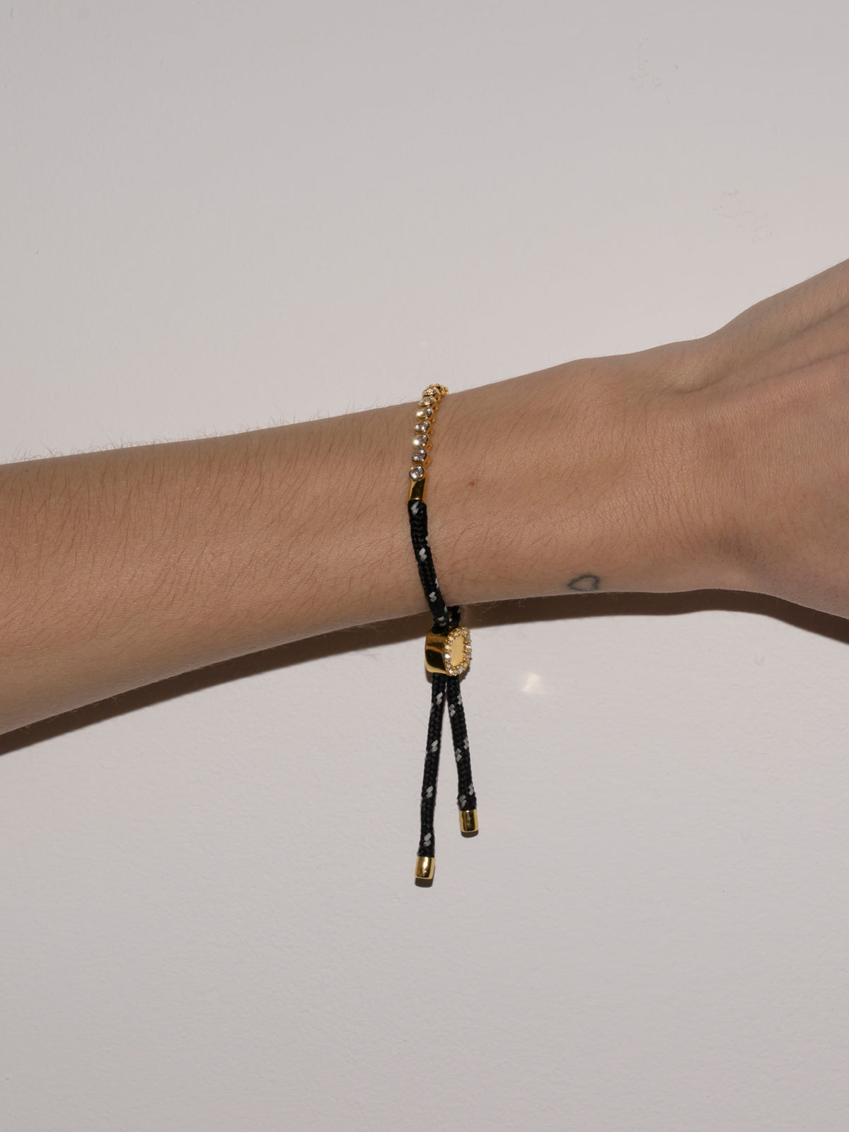 JAMES BEZEL NOIR ET BLANC PARACORD BRACELET, GOLD