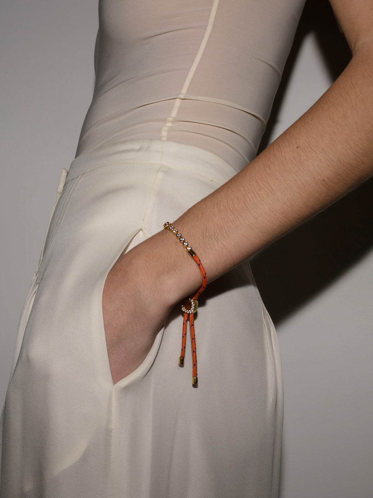 JAMES BEZEL ORANGE PARACORD BRACELET, GOLD