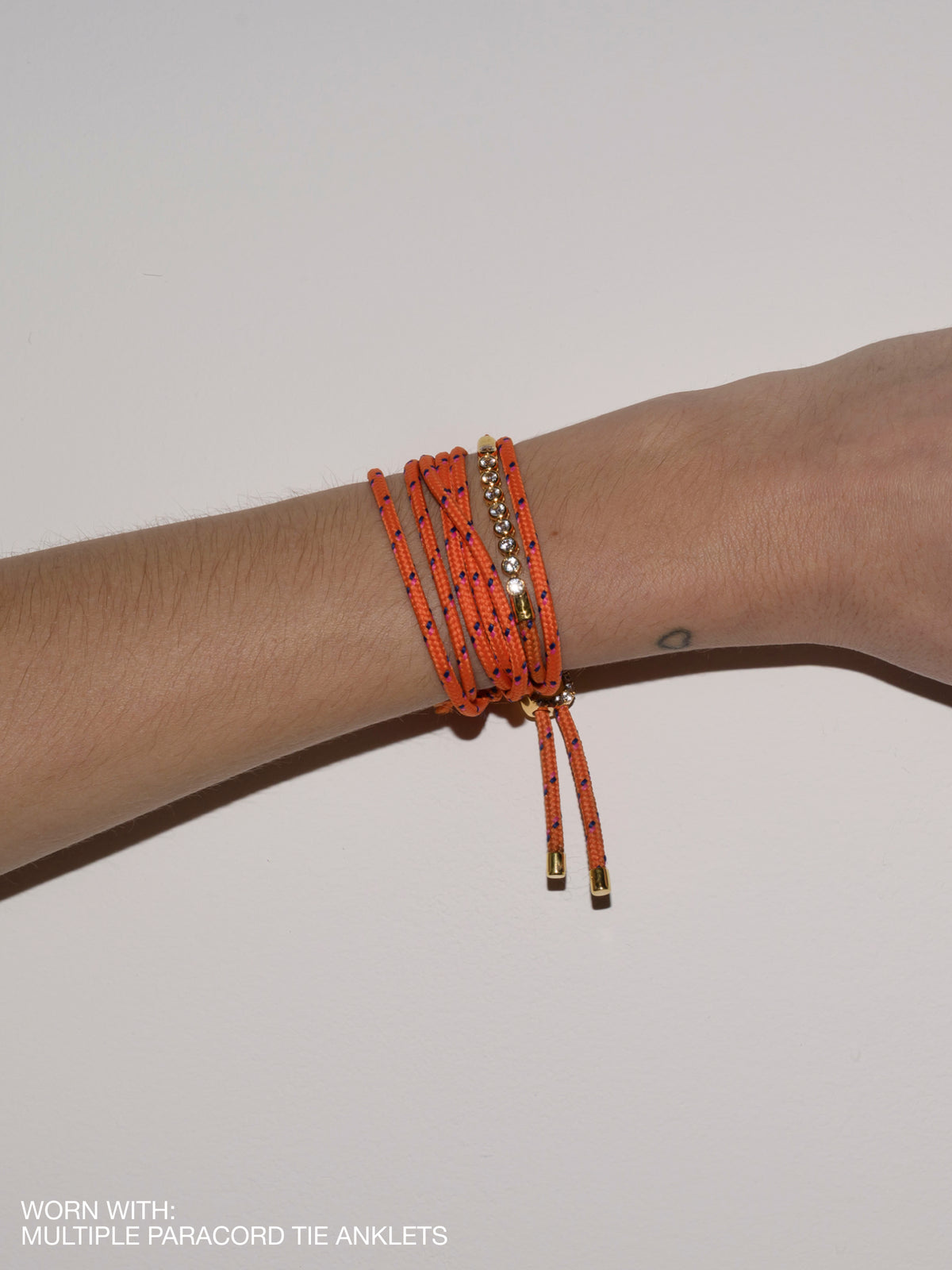 JAMES BEZEL ORANGE PARACORD BRACELET, GOLD